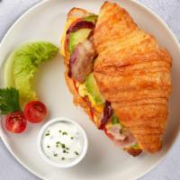 Bacon'S Avolution Breakfast Croissant · Bacon, avocado, scrambled egg, and cheddar cheese served on a croissant.