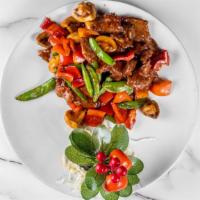 Thai Style Sa-Tai Flavored Beef · Spicy. Served with tender slices of steak sautéed with straw mushroom and sweet pepper in a ...