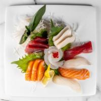 Sushi Sashimi · Served with miso or salad. Served with 1 tuna roll, 5 pieces nigiri, and assorted sashimi.