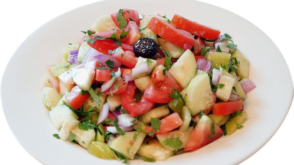 Shepherd Salad · Freshly diced tomatoes, cucumbers, green peppers, onions, parsley, olive oil and lemon juice.