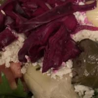 Greek Salad · Romaine hearts, mesclun, artichoke, tomato, cucumber, feta cheese, olives, stuffed grape lea...