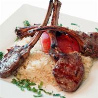Lamb Chops · 4 pieces Char-grilled baby lamb chops served with rice and salad.