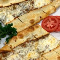 Ground Meat Pide · A flattened dough. Served with ground meat and mozzarella cheese, with melted butter on top.