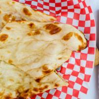 Naan · Traditional Punjabi style tear-drop shaped white bread.