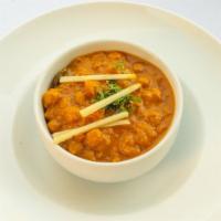 Chana Masala (Vegan) · Gluten Sensitive. White chickpeas tempered with onion, tomatoes, and spices.