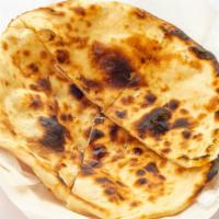 Butter Naan · Traditional white bread, baked in the tandoor.