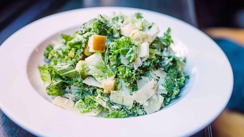 Kale Caesar Salad · A mix of romaine and kale with croutons and house made dressing.