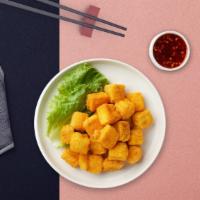 Triple Crispy Tofu Entree · Crispy fried tofu with tamarind, vegan sweet chili garlic sauce, served on top of steamed mi...