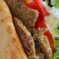Lamb Gyro · Halal. Cooked on a spit and wrapped in a pita.