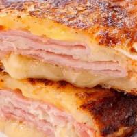 Monte Cristo · A ham and cheese sandwich, dipped in egg and cooked like French toast to perfect golden brow...