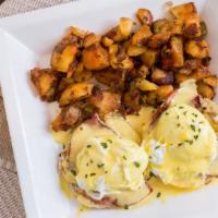 Eggs Benedict · 2 poached eggs, ham, and two English muffins, topped with hollandaise sauce.