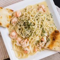 Shrimp Scampi · sautéed ship, butter, garlic, spaghetti, garlic bread and side salad.