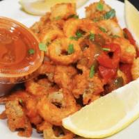 Spicy Firecracker Calamari · Served with hot red peppers, sautéed onions and a sweet and spicy dipping sauce.