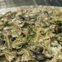 Farfalle Alla Michelina · Bowtie pasta with porcini and cremini mushrooms in a light mascarpone and Parmigiano sauce.