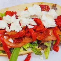 Herb'S Sandwich · Goat cheese with fresh tomato and roasted peppers and sun-dried tomatoes.