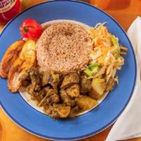 Curry Goat · Meals served with choice of rice and peas or white rice, steam vegetable, and  fried sweet p...