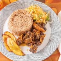 Oxtail · Meals served with choice of rice and peas or white rice, steam vegetable, and fried sweet pl...