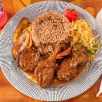 Brown Stew Chicken · Meals served with choice of rice and peas or white rice, steam vegetable and fried sweet pla...