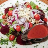 Large Rasp Mesculine · Mesculine, gorgonzola cheese, tomatoes, red onions, beets, and glazed walnuts with a raspber...