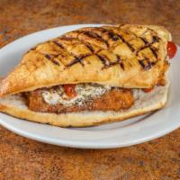 Fritto · Fried chicken cutlet, fresh mozzarella, fire roasted peppers, and balsamic dressing.