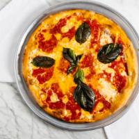Margherita Pizza · Pomodoro sauce, fresh mozzarella, fontina, basil and parmigiano.