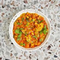 Vegetable Curry · Mixed vegetables cooked with ground spices and curry sauce.