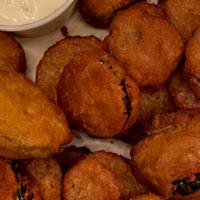 Fried Pickles · Soaked in buttermilk beer batter and served golden brown with cool ranch.