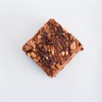 Brownie · Rich chocolate brownie made with pure melted chocolate and topped with chopped walnuts and d...