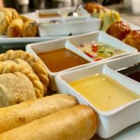 Appetizer Sampler · Mix of 5 favorite appetizers such as curry puff, dumpling, spring roll, fritter and chicken ...