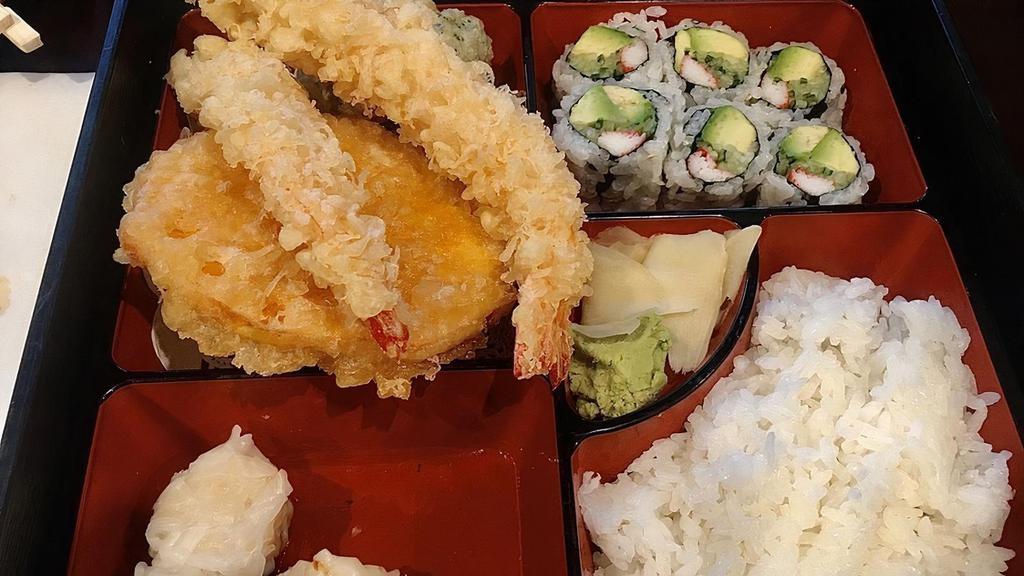 Sushi Bento Box · 5 pieces of assorted of sushi .Served with soup, salad, shumai, shrimp tempura, California roll, and white rice.