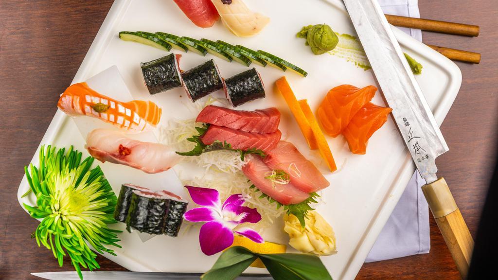 Sushi And Sashimi Combo · Four pieces sushi, nine pieces sashimi, and California roll. Served with soup and salad.