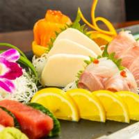 Chef Inspiration Sashimi · 18 pieces of chef's selected sashimi. Served with soup and salad.