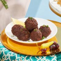 Falafel (4Pc) · Crispy fried falafel made of chickpeas and herbs.