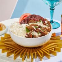 Lamb Shawarma Bowl · Juicy lamb over rice with hummus, tomatoes, grilled onions, and drizzled with your choice of...