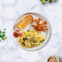 Terra Bites Omelette · Eggs cooked with spinach, feta cheese, and tomatoes as an omelette served with toast and hom...