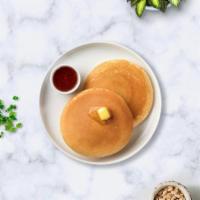Fluffy Buttermilk Pancakes · Fluffy pancakes cooked with care and love served with butter and maple syrup. Served in pairs.