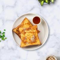 Classic French Toast · Fresh brioche battered in egg, milk, and cinnamon cooked until spongy and golden brown. Topp...