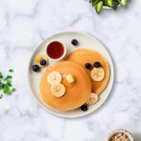 Berry Star Pancakes · Buttermilk pancakes with blueberries, strawberries, and banana.