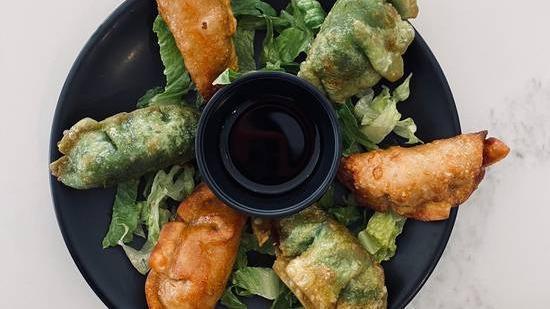 Spinach Dumpling · Dumplings with gyoza sauce.