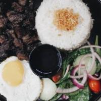 Beef Tapsilog Plate · Filipino style cured beef with fried egg, fried onion with white rice and side salad