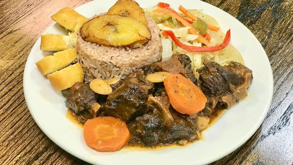 Oxtail · Delicious Oxtail served with your choice of White Rice or Rice & Beans and your choice of Salad or Steamed Vegetables.