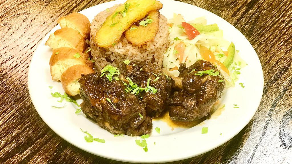 Brown Stew Chicken Mon & Tues · Chicken falling off the bone, stewed to perfection with potatoes and vegetables.  Served with festival, steamed vegetables and choice of white rice or rice and beans.