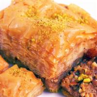 Baklava- Small · Baklava is a rich, sweet dessert pastry made of layers of filo dough filled with chopped nut...