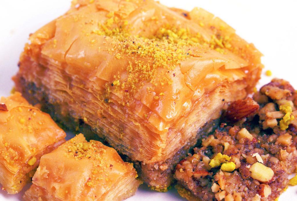 Baklava- Large Assorted · Baklava is a rich, sweet dessert pastry made of layers of filo dough filled with chopped nuts and sweetened and held together with syrup or honey.