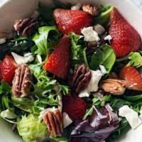 Strawberry Pomegranate Salad · Spinach, fresh strawberries, pomegranate, feta cheese, cucumbers, tomatoes, walnuts.
Dressin...