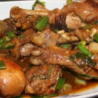 Pollo Guisado/ Stew Chicken · rice and bean