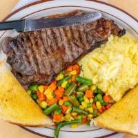 Steak & Eggs · Two eggs your way with a juicy N.Y. strip steak. Served with choice of home fries or hash br...