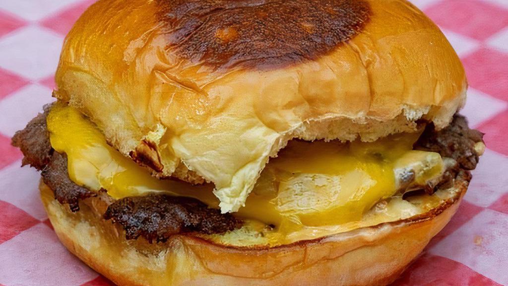 Cheeseburger · Single patty, 100% fresh beef burger served with American cheese, grilled onions, pickles and house sauce on a Martin's potato bun