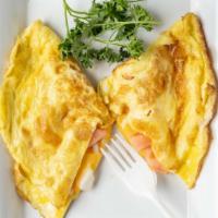 Cheese Omelette · Cheese lover's omelette with a mix of American, Swiss and Cheddar cheese.