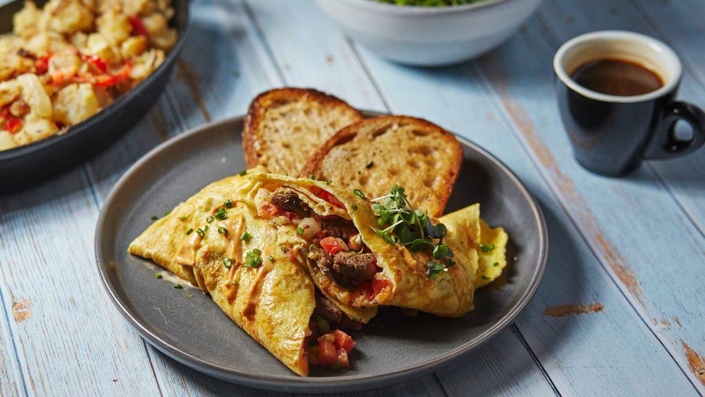 Build Your Own Omelette Combo · Create your own omelette with four fluffy eggs, your choice of protein, toppings, and sauce. Served with tater tots or salad and toast.